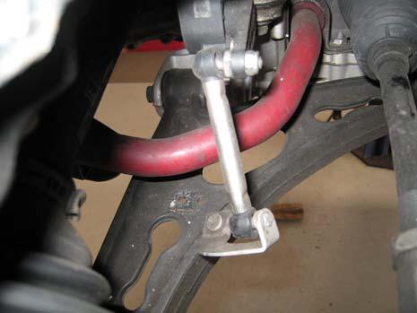 Photo 3 6. Loosen and remove the nut that secures the sensor link to the lower control arm.