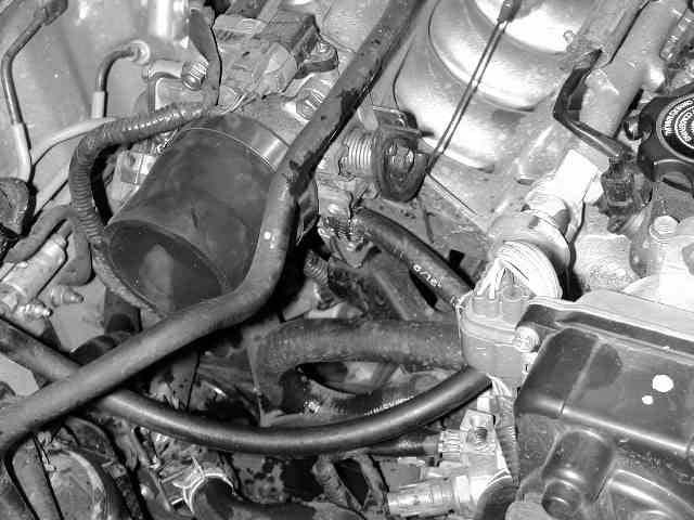 c) Insert the AEM intake pipe in to the engine bay 2.5 end first, from the bottom of the car.