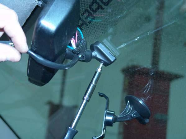 3. Loosen the screw that attaches the existing rear view mirror to the windshield