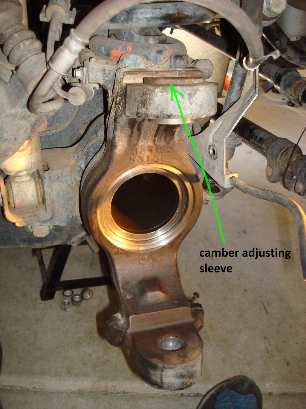 7) Loosen the nuts on the ball joints to be flush with the stud, then start whacking with the sledgehammer.
