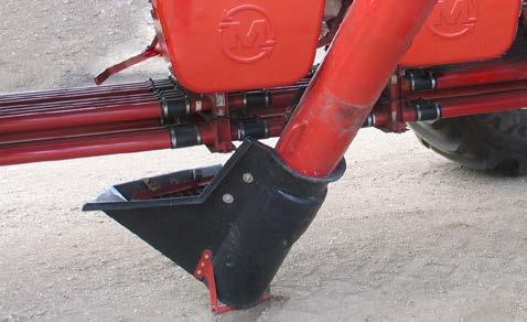 Open seed plate to first lock point, this will allow material to flow through the metering body into the auger.
