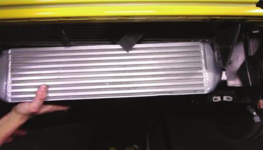 Lift the intercooler up and into the vehicle.