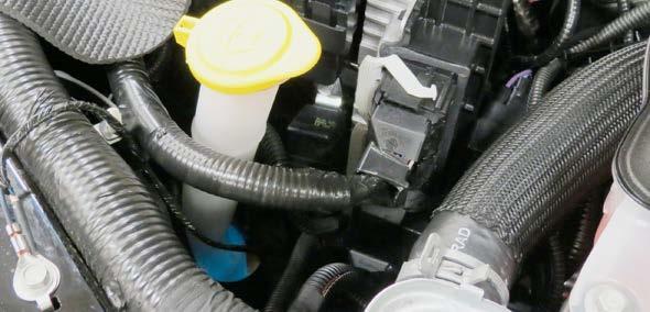 97. Install the stock driver side PCV hose onto the passenger side PCV fitting and attach it to the passenger