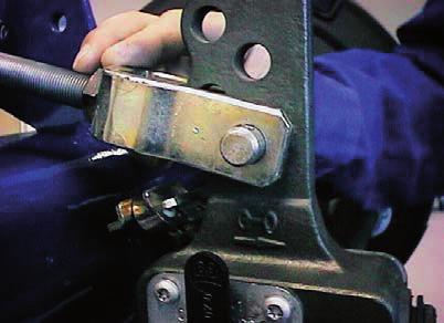 Adjust the auto slack into position so that the clevis pin can be engaged and
