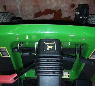 post ROPS guard, remove seat from seat plate. 2. Take the left rear bracket, one short tube spacer, and one long tube spacer and position it onto the left lower 2-post ROPS member.