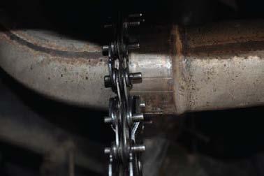 H) 5) Carefully slide the muffler and tailpipe from the clamped or flanged location.