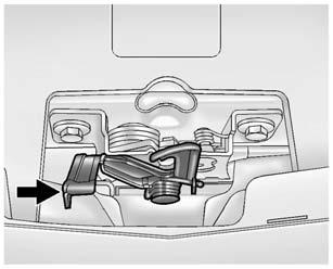 Vehicle Care 229 2. Go to the front of the vehicle to find the secondary release handle. The handle is under the front edge of the hood near the center.