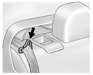 56 Seats and Restraints 3. Make sure the outboard safety belt is in the belt guide. 4. Pull on the lever on the top of the seatback to unlock it.