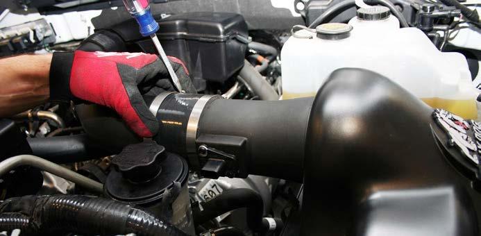 some vehicles adjust accordingly by pressing the tube away from the power steering reservoir and