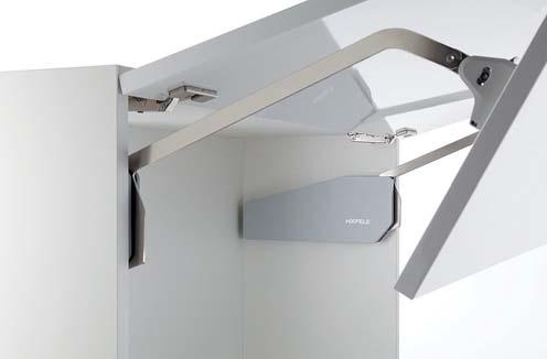 Flap Fittings Free fold Double flap lift-up fitting For 2-piece flaps with division 1:1 made from wood or with aluminium frame Even high front panels can be lifted up in a space-saving way Modern