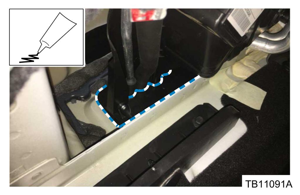 b. From inside the vehicle, remove the driver side load space trim panel to reveal the rear A/C evaporator lines.