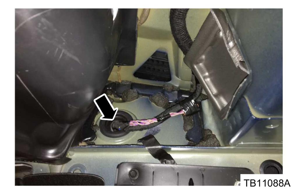 a. Thoroughly wrap the wiring harness with Rotunda Coroplast electrical wire harness tape where the 3 leads meet underneath the vehicle, up to the grommet