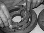 Avoid applying too much grease on the seals during assembly since this condition can cause the O-rings to dislodge when the port plates are installed in the pump. Fig. 1.2.