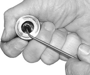 Install the high-pressure seal. Place the seal so the open V portion is toward the head ring.