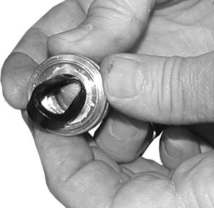 Make sure the seal is totally seated against the head ring. (See Figure 15) 3. Installing the low-pressure seal.