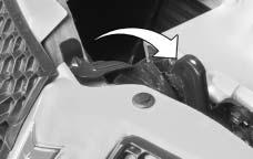 2. Go to the front of the vehicle and release the secondary hood latch, located near the center front of the engine compartment, by moving it to