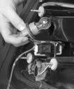 7. Turn the appropriate lamp socket a quarter turn counterclockwise and remove it. Back-Up Lamps The back-up lamps are located on the trunk lid. 8. Remove the old bulb. 9.