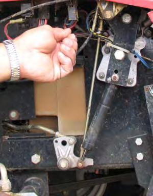 Continue turning the linkage arm until the wheel starts to rotate backward.