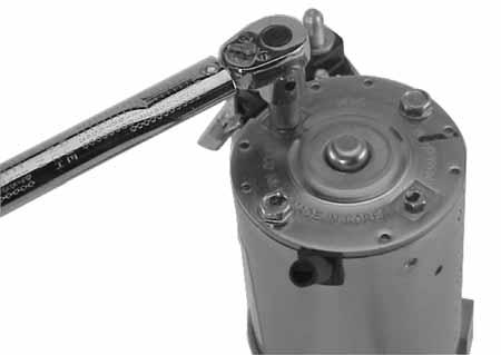 Figure 7-66. Torquing Brush Holder Screws. the drive lever, and install the spring into the through the holes in the drive end cap.