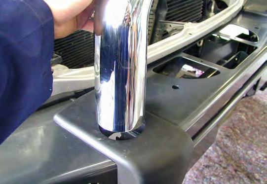 6. 1. Push the top chrome tube through the hole in the buffer and fasten using the