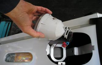 Smear grease onto the light mounting pivots to help when sliding fog light back into mounting