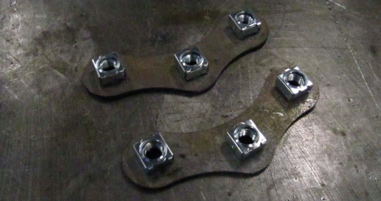 Attach the buffers to the bar as shown using 12 M6 flange nuts.