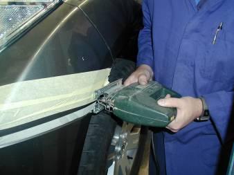 PREPARATION TO VEHICLE 11. Using an electric jig saw with a fine cutting blade - use the top of the 1mm tape as the cutting line.
