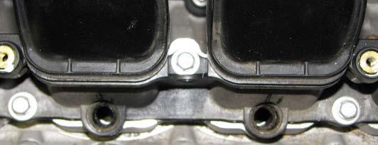 Use a flat head screwdriver to loosen the worm clamps that retain the air inlet tube between