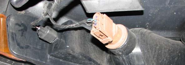 49. Pull the front bumper cover away from the fender and off the clips that hold it in place, then