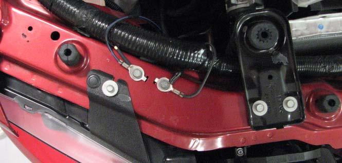 Extend the slot in the driver side shroud that allows the power steering hard lines to pass through it, then