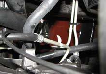 103. Then route the hose behind the manifold