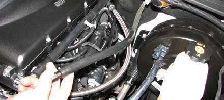 110. Install the driver side PCV hose by sliding it onto the rear barb located on the driver side valve cover.