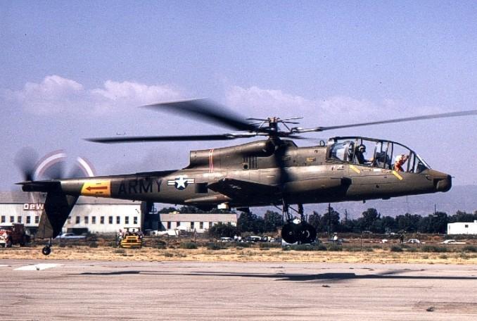 dedicated attack helicopter. Lockheed designed the AH-56 utilizing a rigid-rotor and configured the aircraft as a compound helicopter; with lowmounted wings and a tail-mounted thrusting propeller.