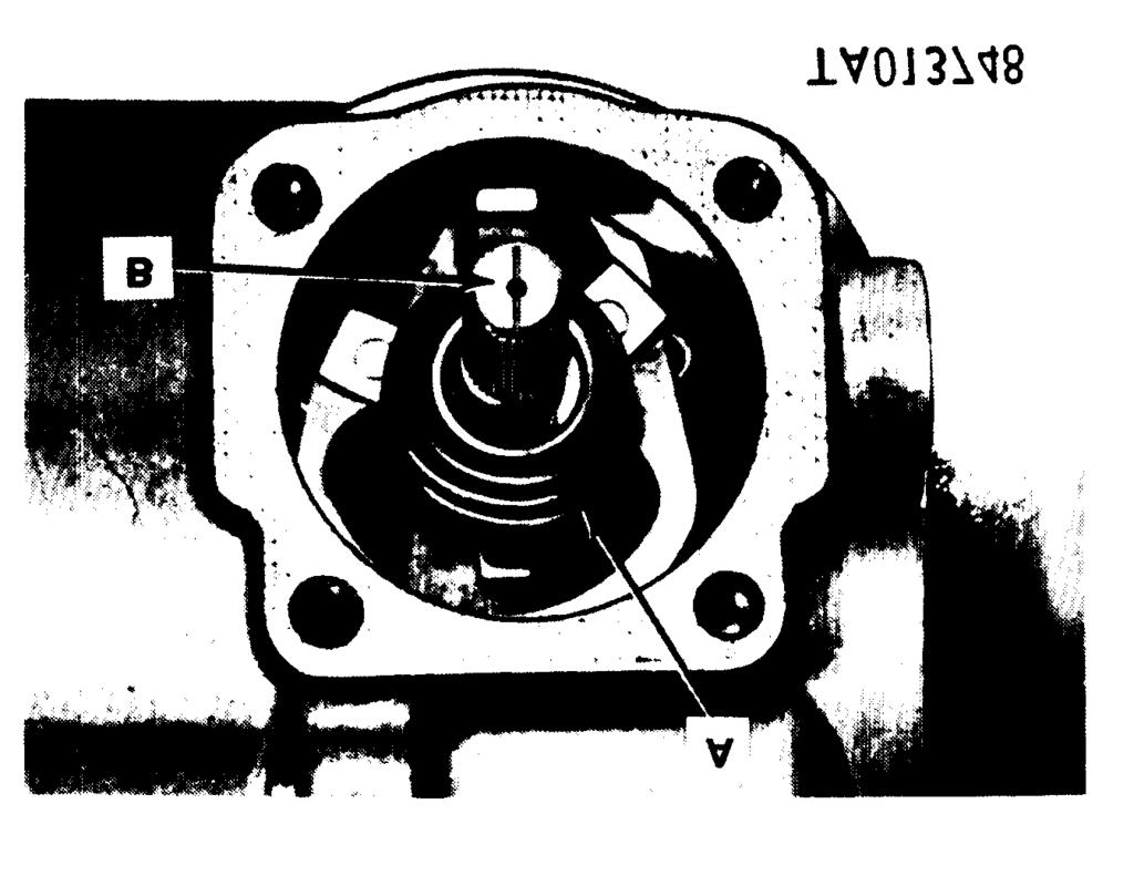 spring plate (B). Refer to figure 3-80.