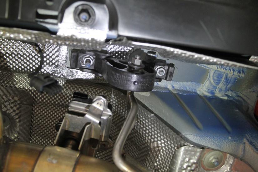 4. Using a 13mm socket, remove the (2) nuts securing