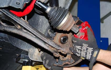 REMOVING THE ORIGINAL FRONT STRUTS Step 9: Pull each outer CV joint out of it s wheel bearing by pulling the