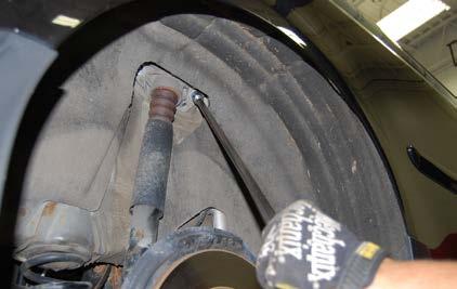 bolts on each side. Step 4: Remove the shock absorbers from the car.