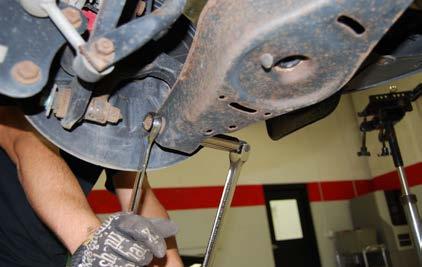 Step 6: Lift the rear lower control arms slightly using a floor jack or similar type of lifting equipment.