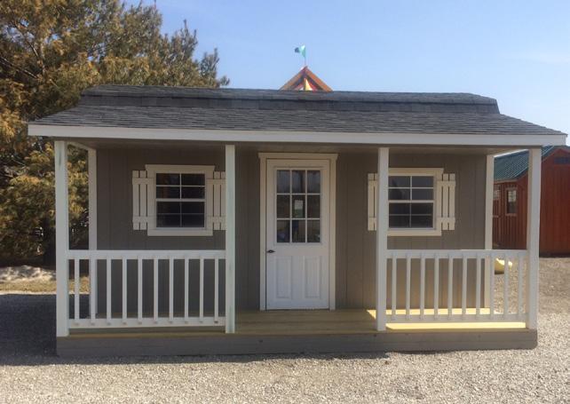 Gambrel Barn with Full Side Porch 1-30'' Door 1-60'' Door 2-24''x27'' Windows 4' Porch x Length of Building Size of Barn includes Porch Shown is 16'x12' with 6'' Overhangs 12 x12 $3,305 14 x12 $3,485