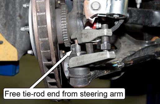 14. Torque the ½ nylock nut that secures the tapered stud to the steering arm to 65 ft-lbs.