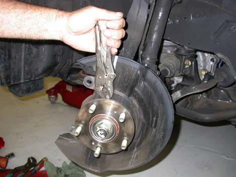 Step 4 Remove Dust Shield The dust shield must be permanently removed from each front wheel of