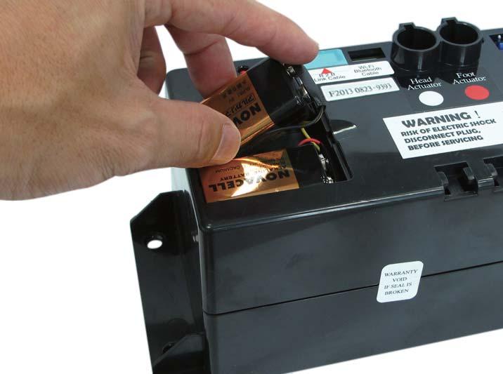 STEP 2 Install the two (2) alkaline 9 volt batteries. Figure 4: Lower the bed using the 9 volt battery backup system.