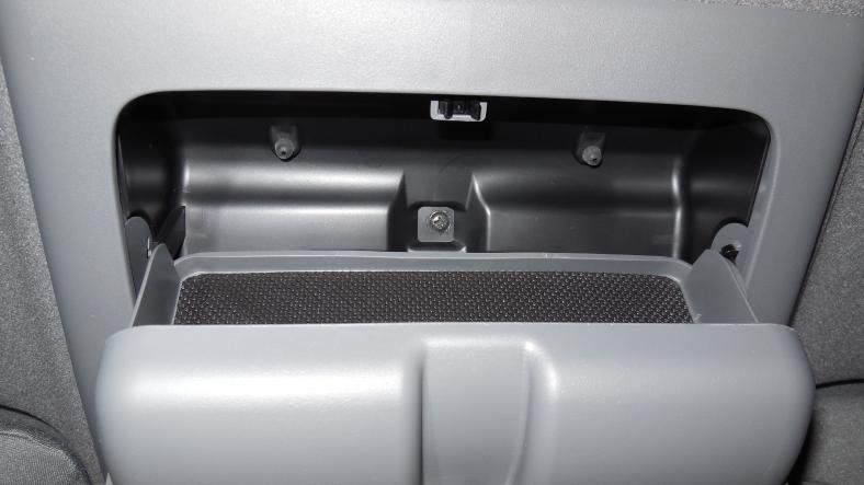 Remove one screw from the overhead sunglass console (rear compartment).