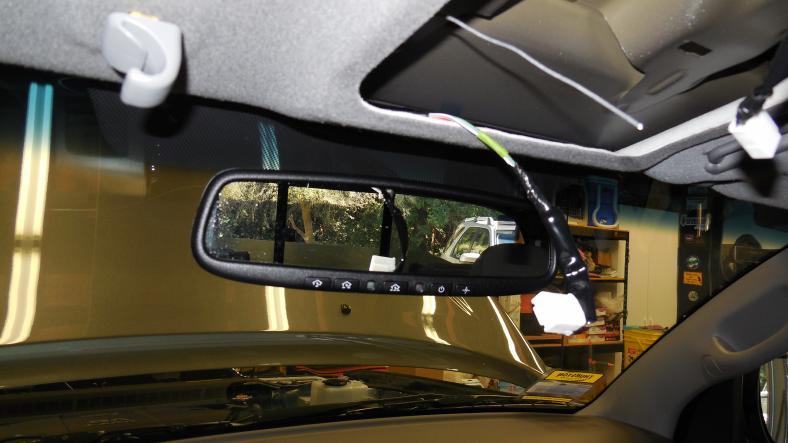 mirror on its leg and then tilt the mirror head down, which now places it about 1 below the headliner.