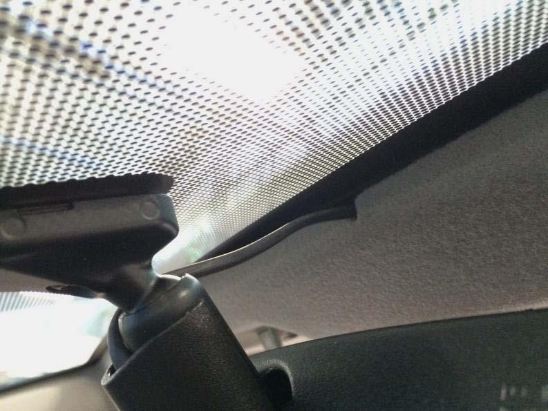 14. Route the mirror harness to overhead console opening using the precut notches on the front of the