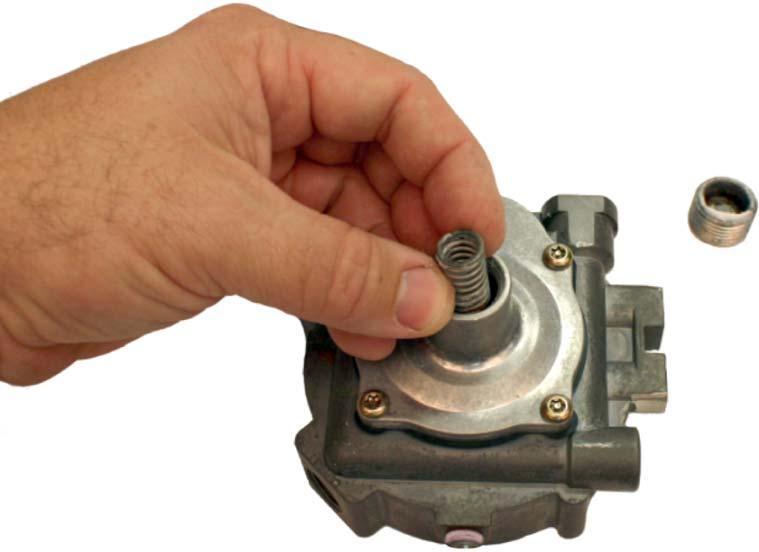 15. Install the primary pressure spring (5) and screw in the spring retainer (6) about four turns. 16.