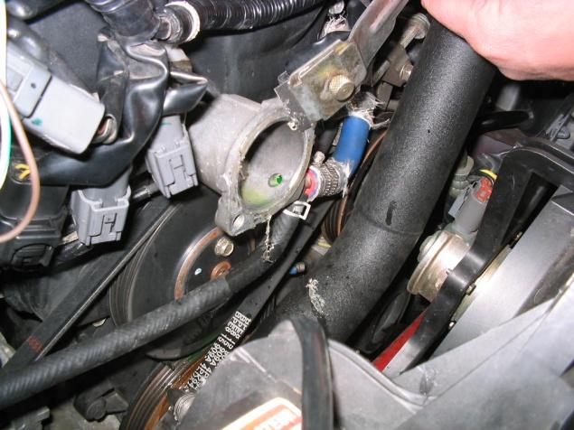 *Below is a picture of us cleaning the gasket on the front of the engine, but the procedure is the same.