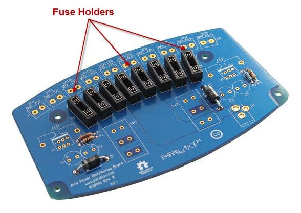 The fuse holders should be a friction-fit in their holes this will help to hold them in position as you flip the board over and solder them.