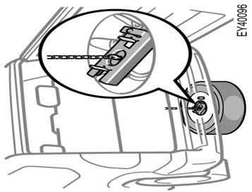 After the tire is lowered completely to the ground, remove the holding bracket as shown in the illustration.