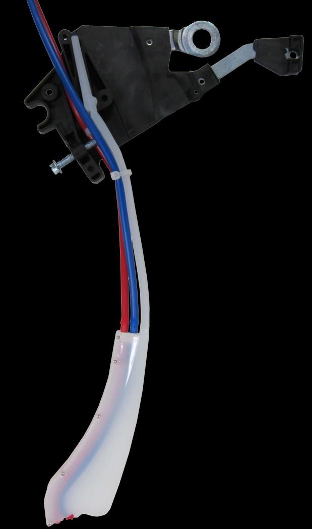 Once the tubing is in place, route the white tie strap through the small loop located in the middle of the firmer tail. Pull the tie strap together and tighten it, until it is snug against the tubes.